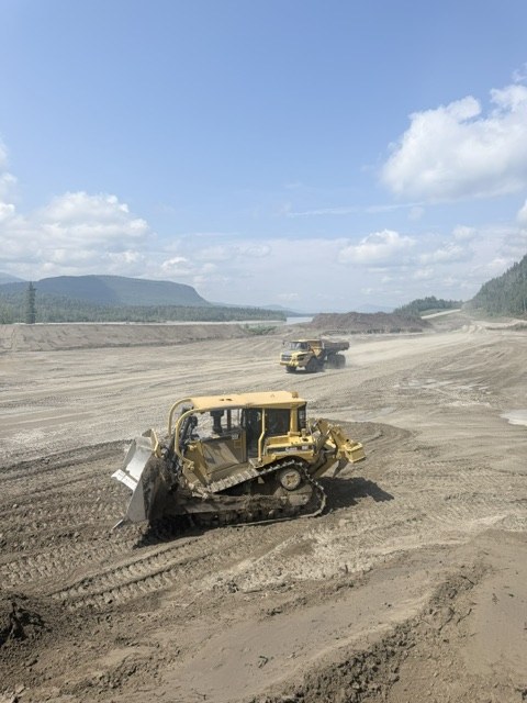 Dozer and rock truck working on a northern site
