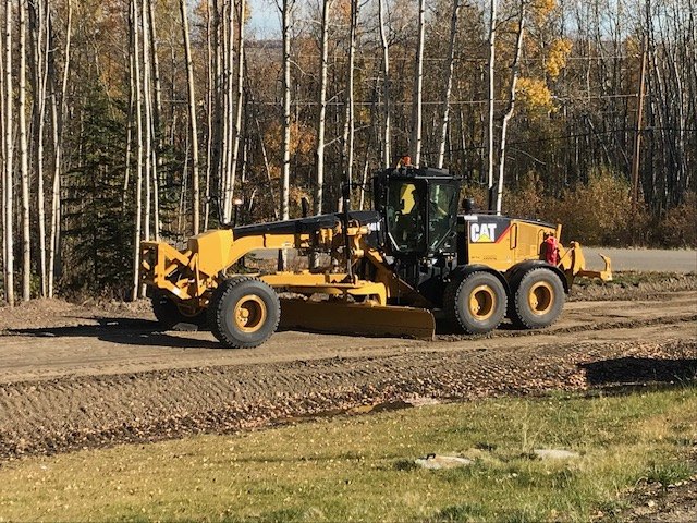 Cat 14M motor grader building an access road
